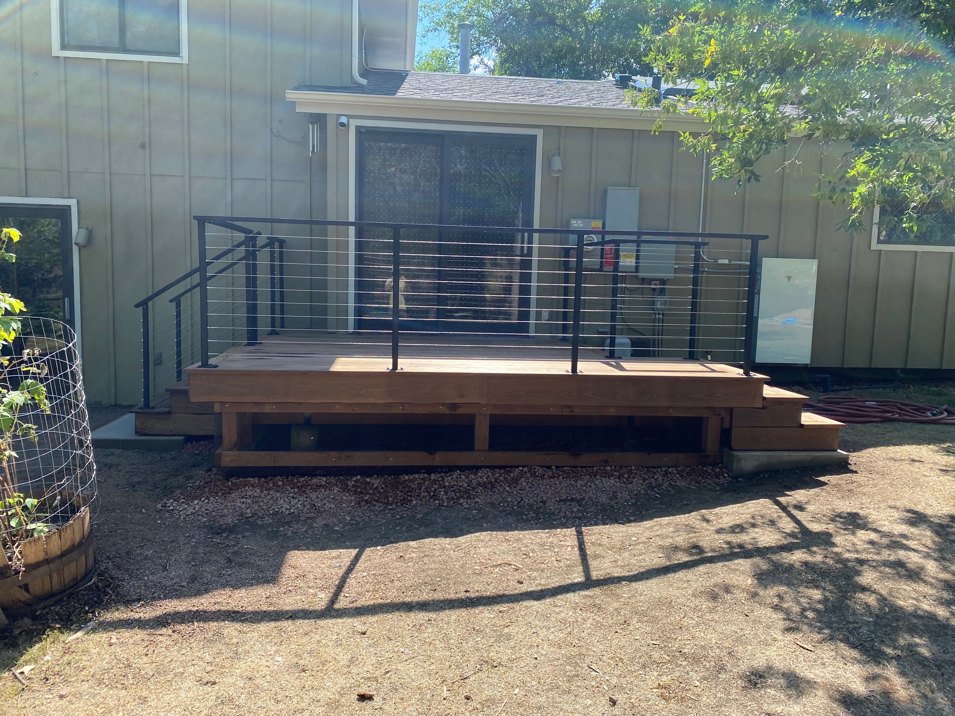 Straight-on view of the low-profile deck and steel cable railing