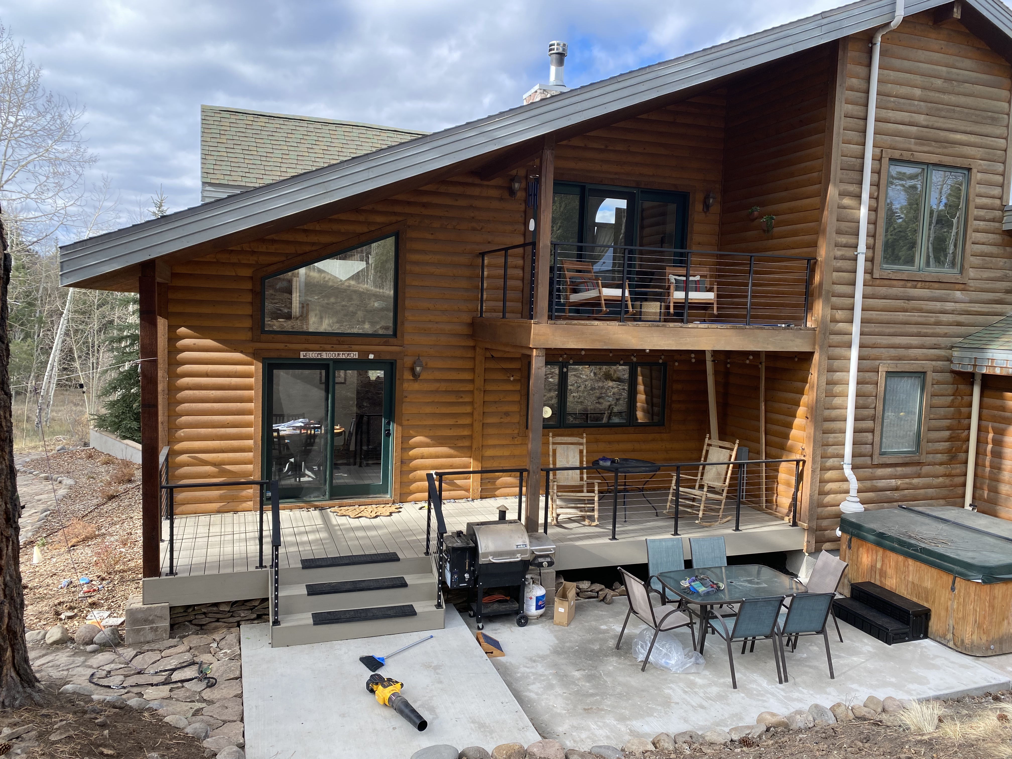 New stair run with non-slip treads down to the concrete patio